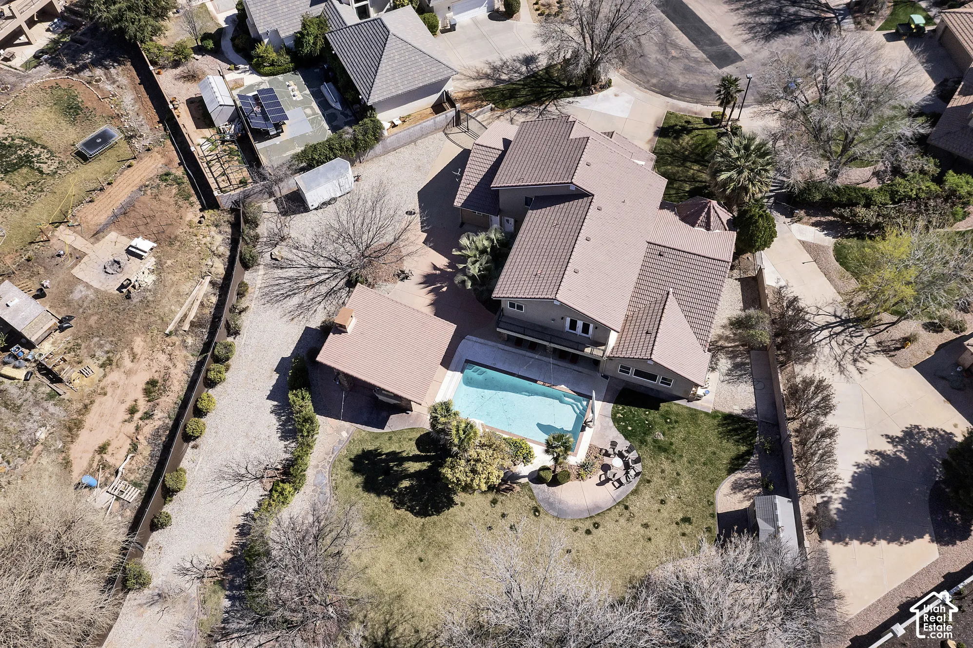 Multi-level residence featuring a swimming pool, patio area, and expansive lawn