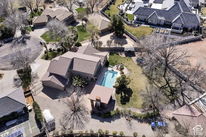 Expansive property featuring a private swimming pool, dedicated poolside cabana, and mature landscaping