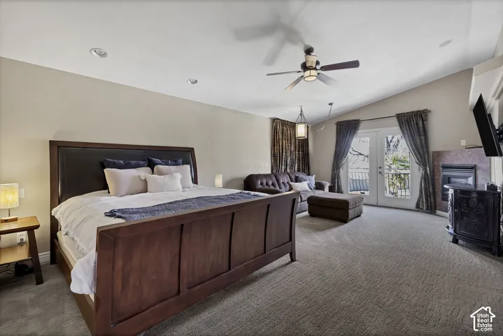 Vaulted ceiling with a ceiling fan, recessed lighting, and a built-in fireplace