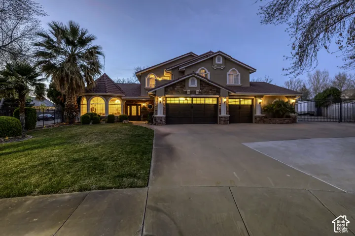 Stucco exterior with stone accents and arched windows