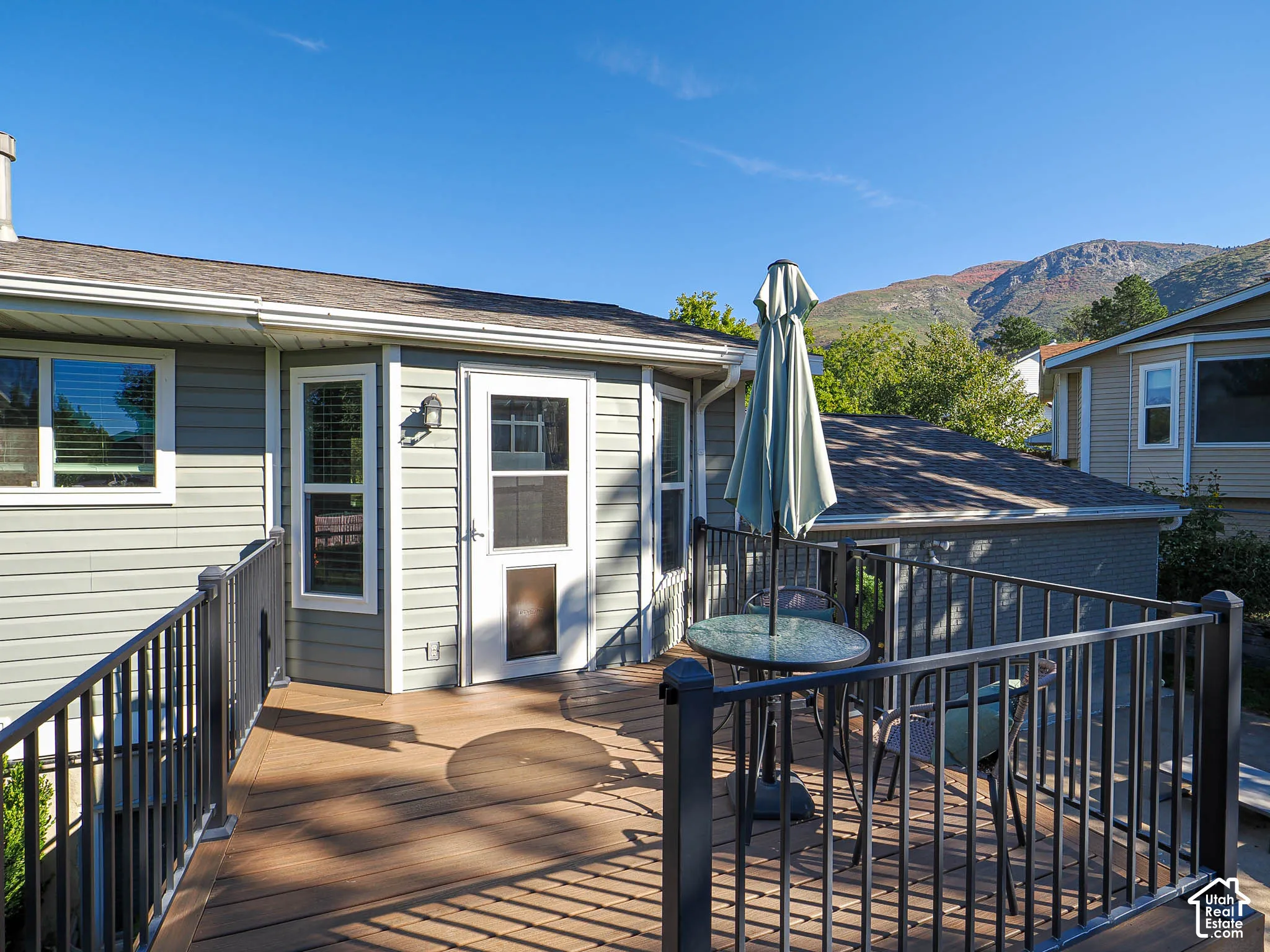 Expansive deck with brown wood-finish decking and black railings