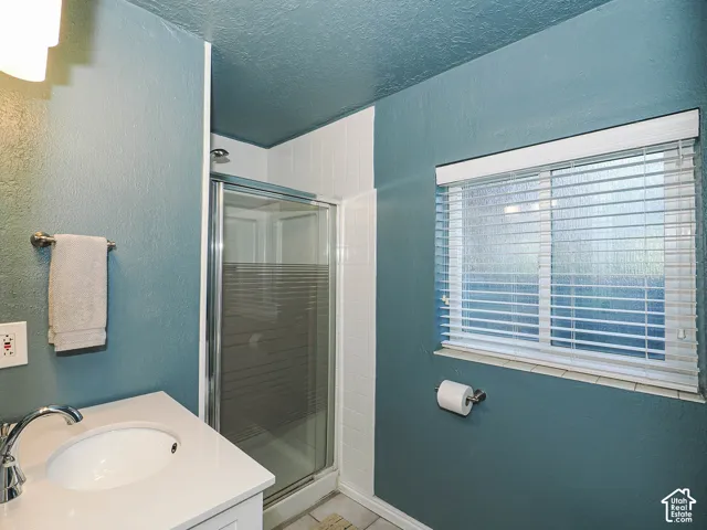 White vanity with an integrated sink and chrome faucet