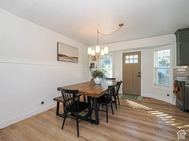 Wood-finish flooring throughout, complemented by white wainscoting and trim
