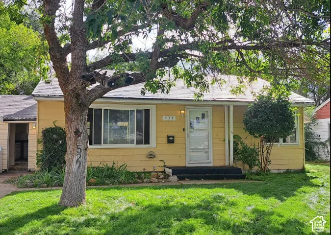Yellow siding exterior with white trim