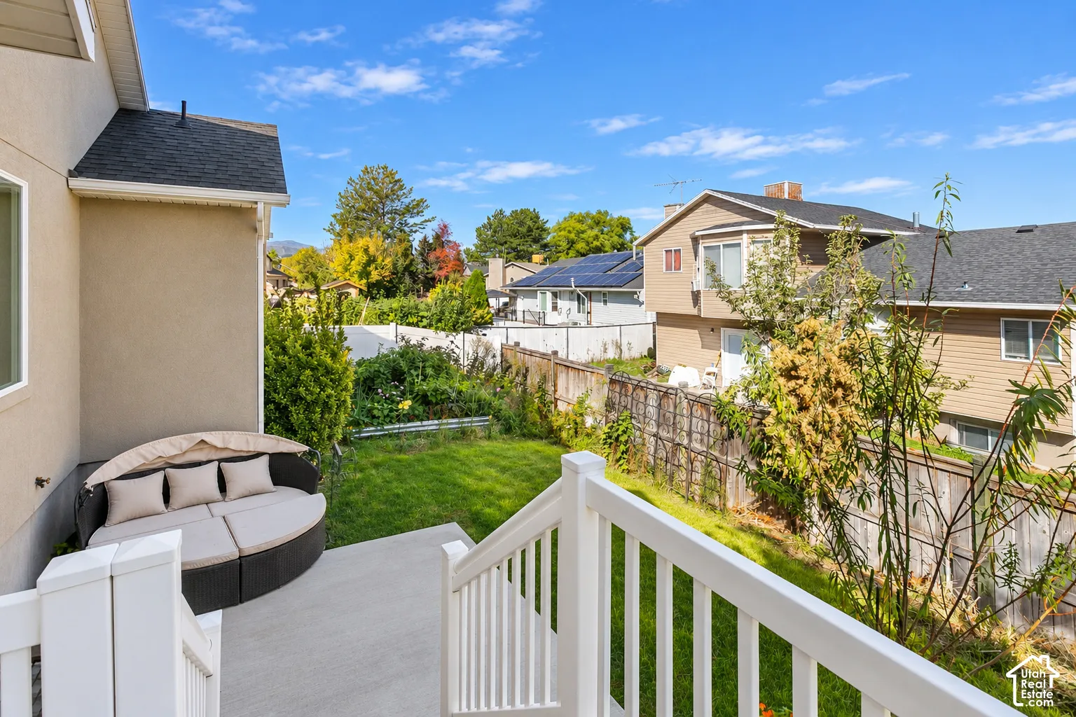 Concrete patio with white railing