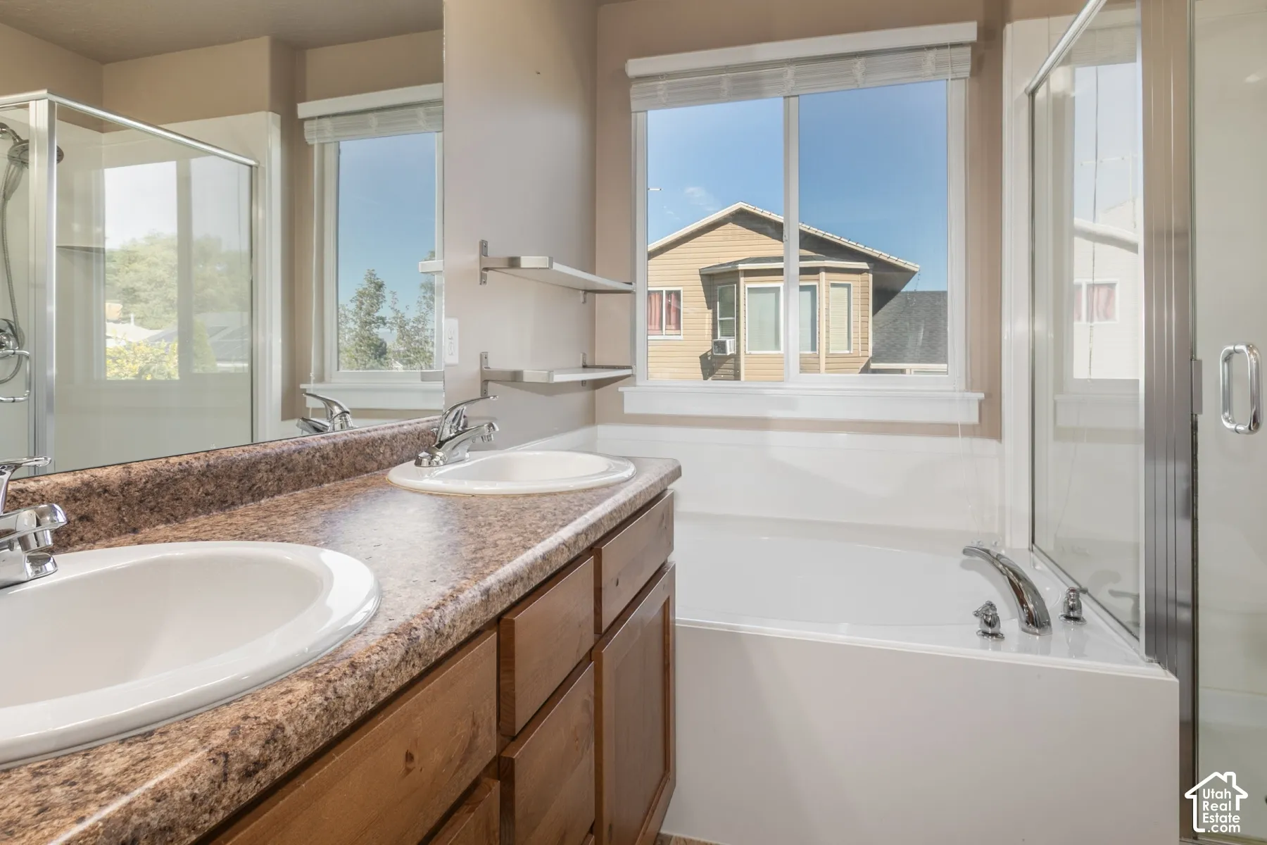 Double vanity with integrated sinks and chrome fixtures