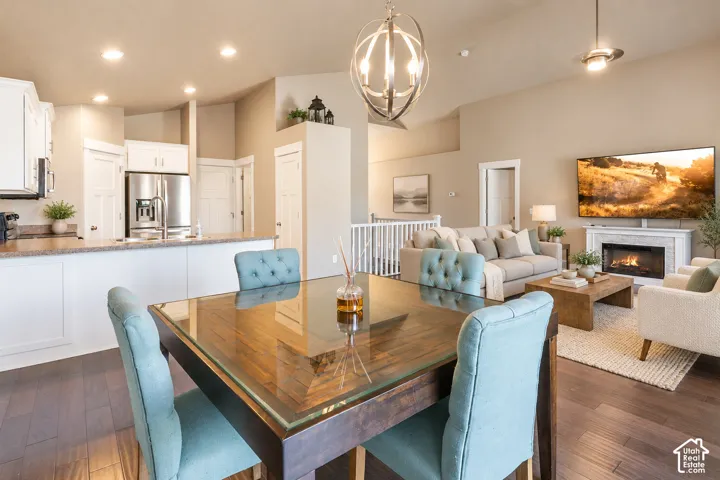 Open-concept living area with vaulted ceilings and recessed lighting