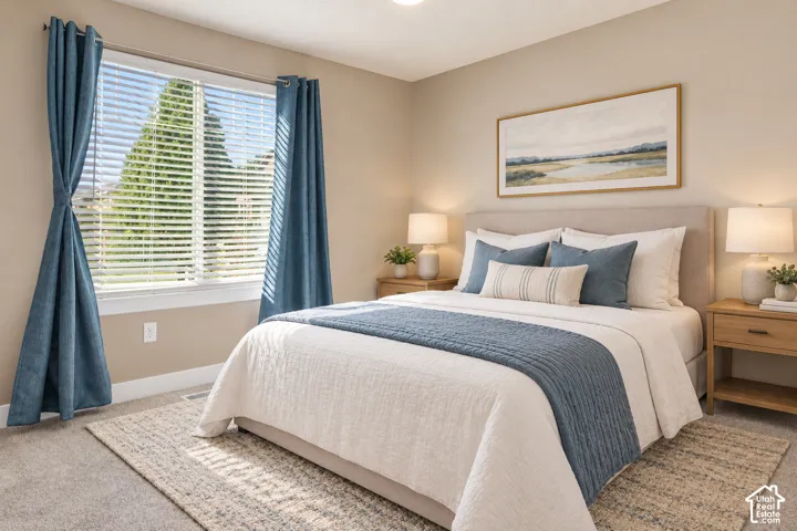 Wall-to-wall carpeting with an upholstered bed frame