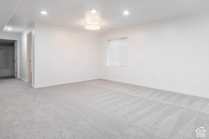 White interior walls and light gray carpet