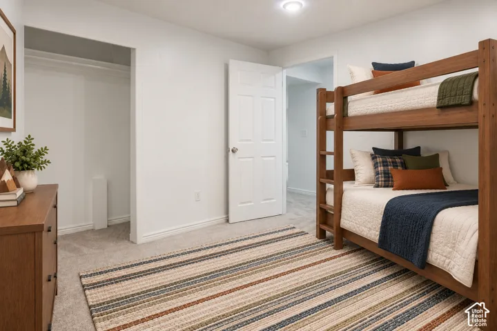 White walls, recessed lighting, and light-colored carpet