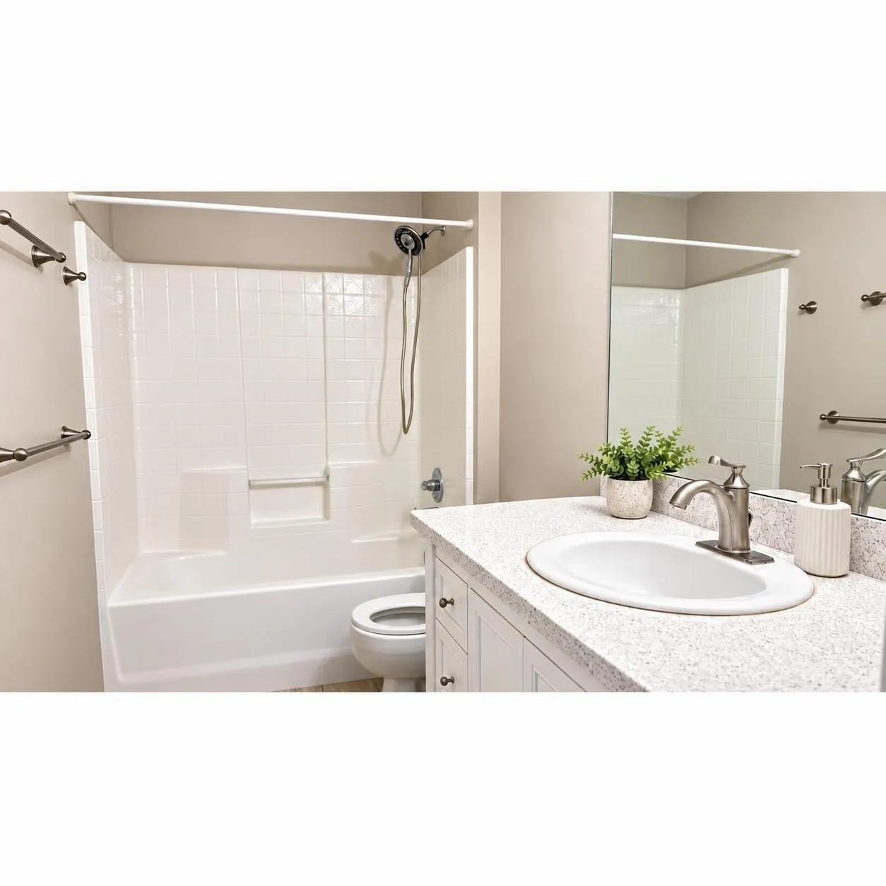 Second Bathroom featuring a white vanity with a speckled countertop, an undermount sink, and a brushed nickel faucet