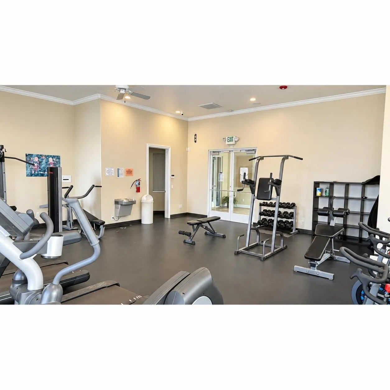 Fitness center with durable rubber flooring and a variety of exercise equipment