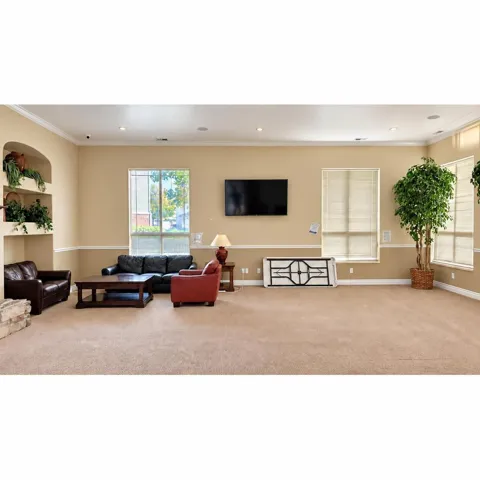 Recessed lighting, crown molding, built-in wall niches, and carpet flooring
