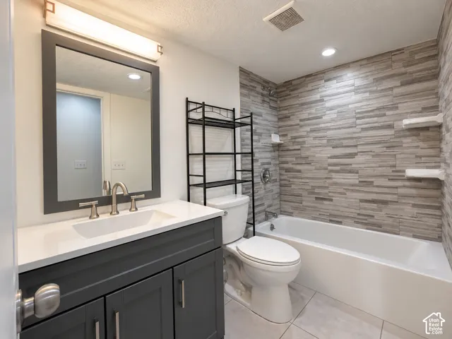 Vanity with integrated sink, modern faucet, and rectangular mirror