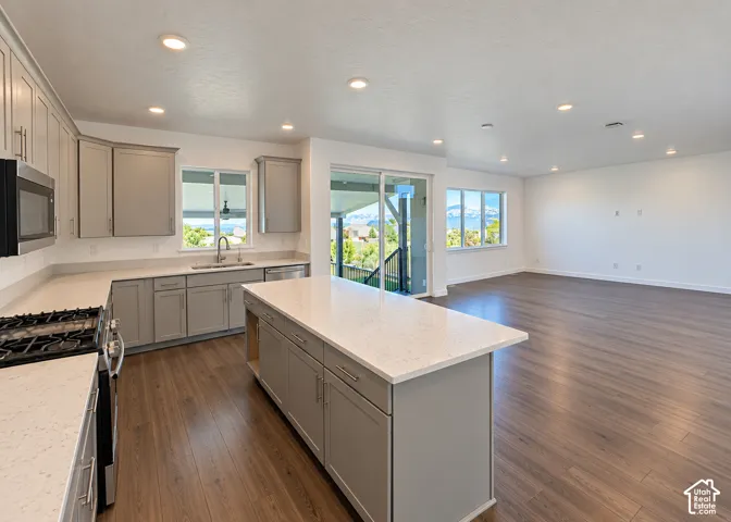 Open-concept living space with wood-finish flooring