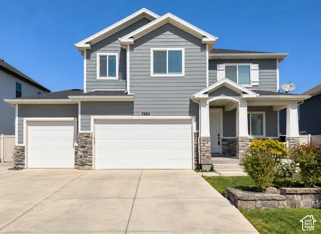Gray siding exterior with white trim accents and a covered front porch