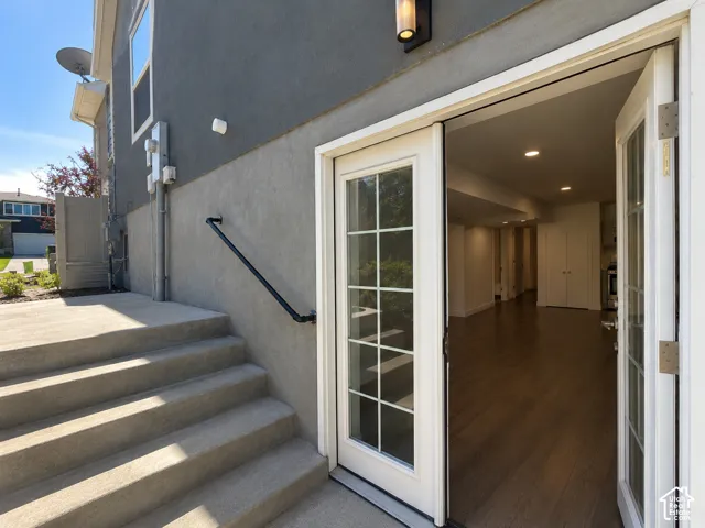 Concrete patio with integrated steps and a black handrail