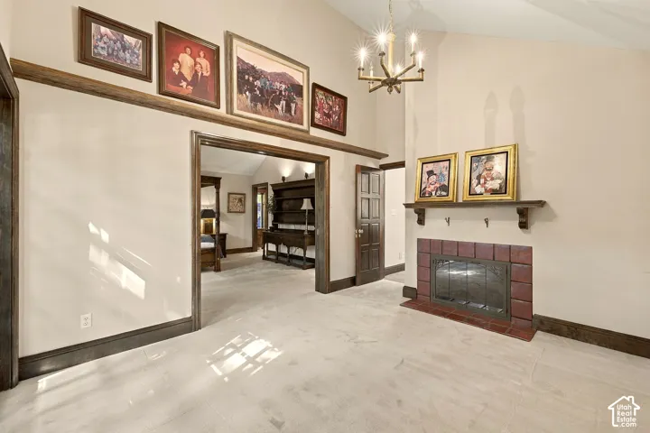 Fireplace with a tile surround, wood mantel, and metal insert