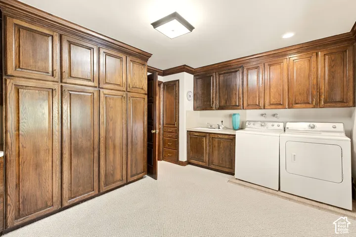 Extensive built-in wood cabinetry, integrated sink, and patterned floor covering