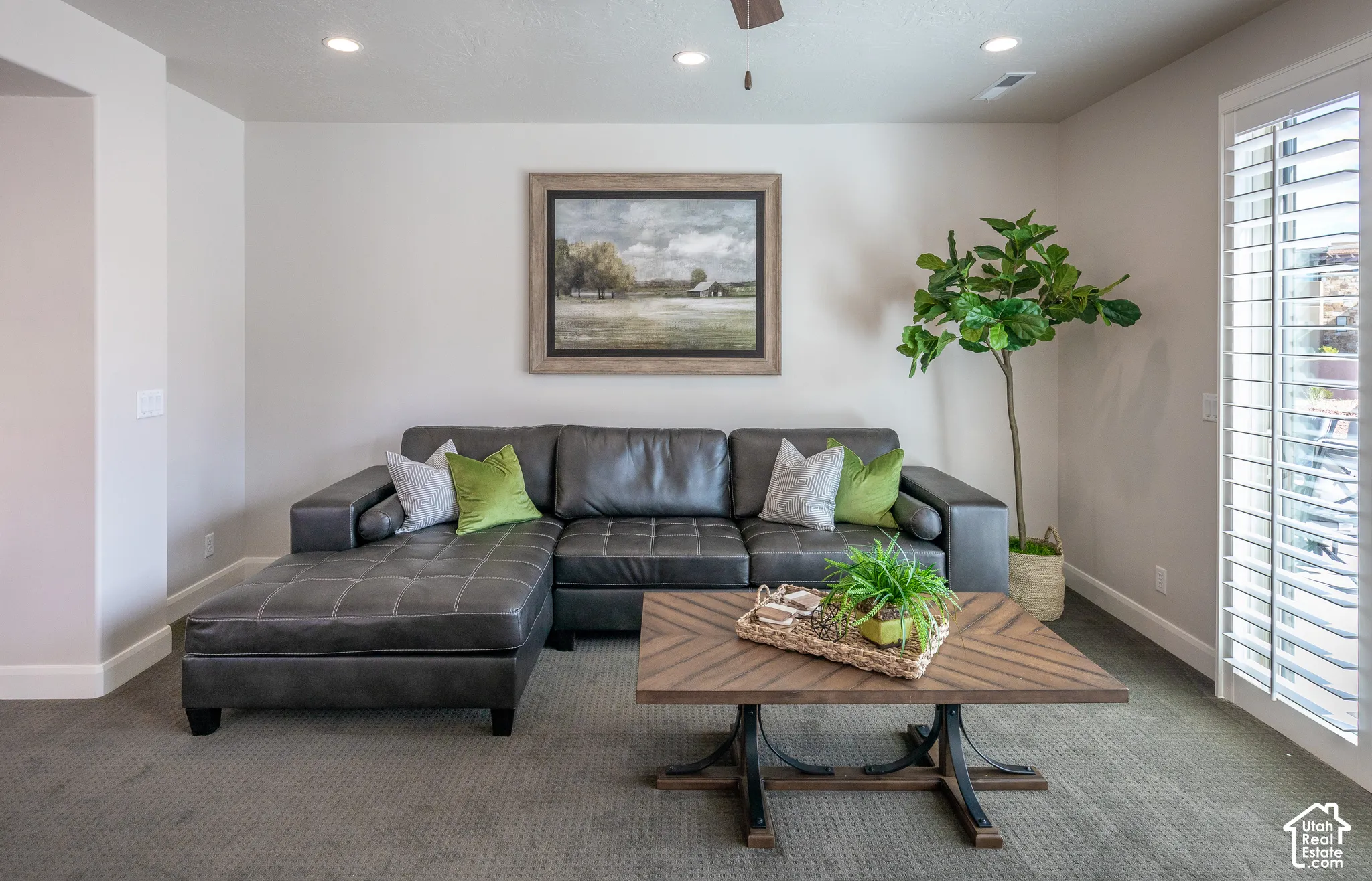 Recessed lighting, ceiling fan, neutral wall tones, carpeted flooring, and white plantation shutters