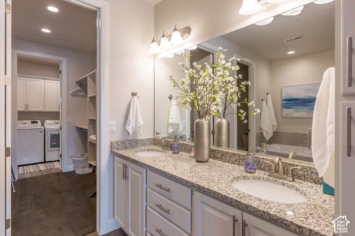 Dual vanity with light-toned countertop and undermount sinks