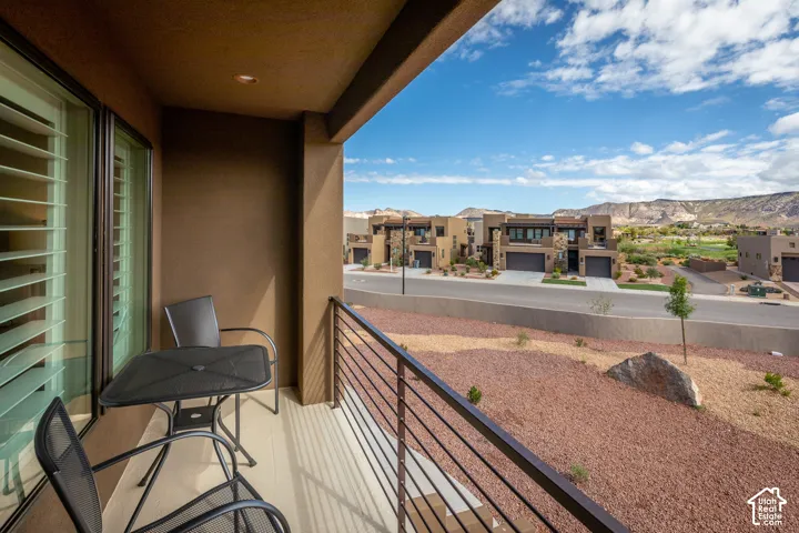 Balcony with metal railing and sliding glass door