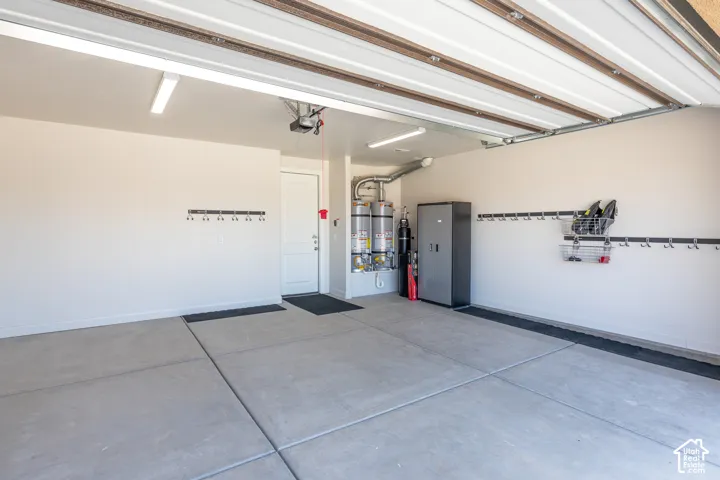 Spacious garage with light-colored walls and concrete flooring