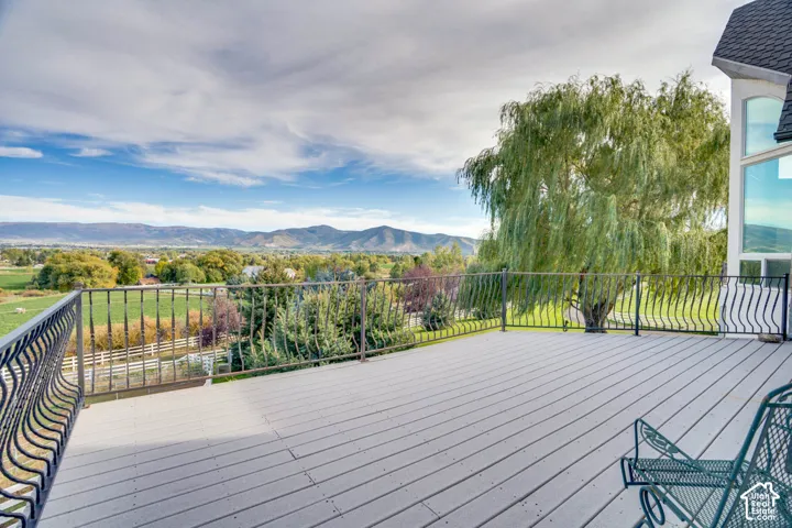 Expansive outdoor deck with composite decking and decorative metal railings
