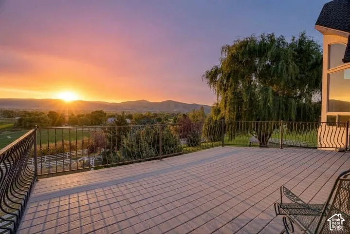 Expansive outdoor deck featuring composite decking and decorative wrought iron railing