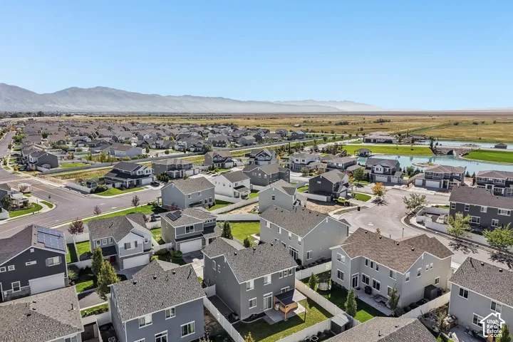 Aerial view showcasing a contemporary residential community with modern architectural designs, manicured landscaping, and well-appointed streetscapes