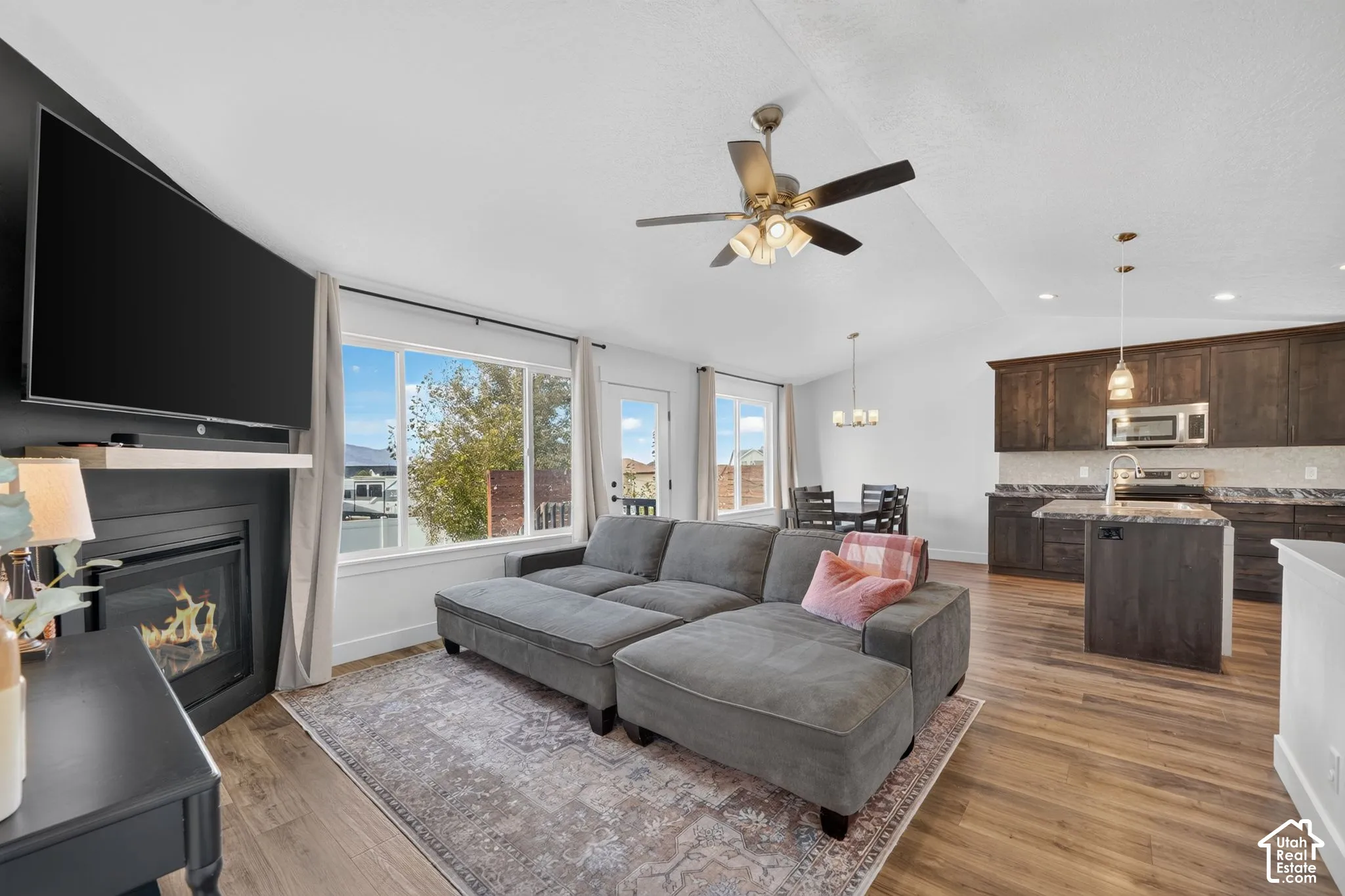 Open-concept living area with wood-finish flooring