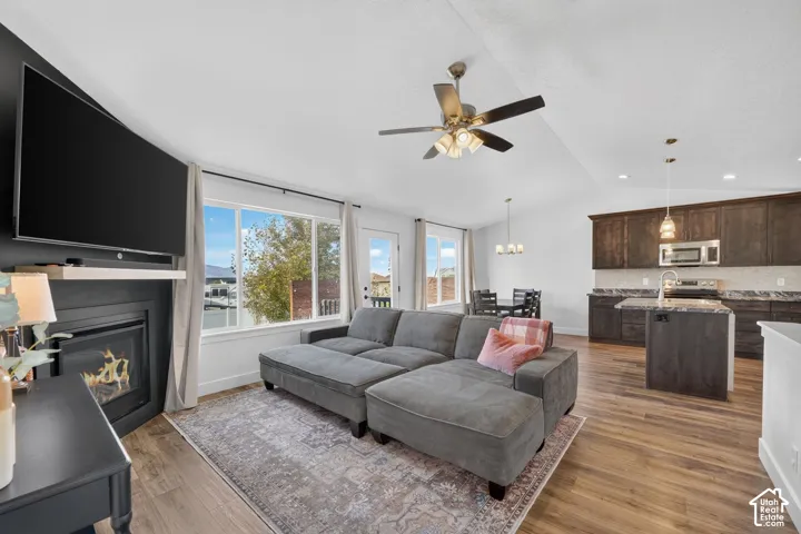 Open-concept living area with wood-finish flooring