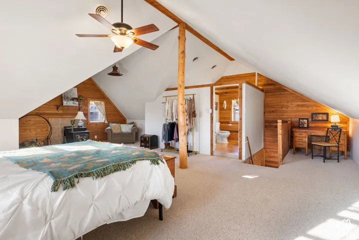 Primary suite with attached 3/4 bathroom, stove and office space.