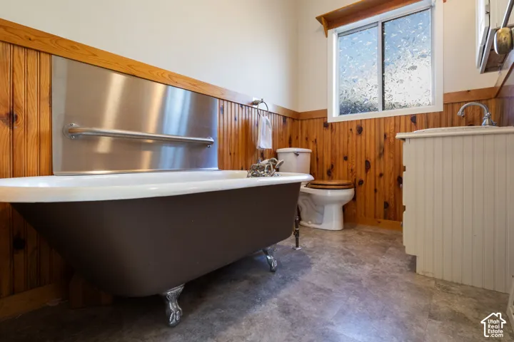 Main floor bathroom with charming clawfoot tub with polished chrome feet