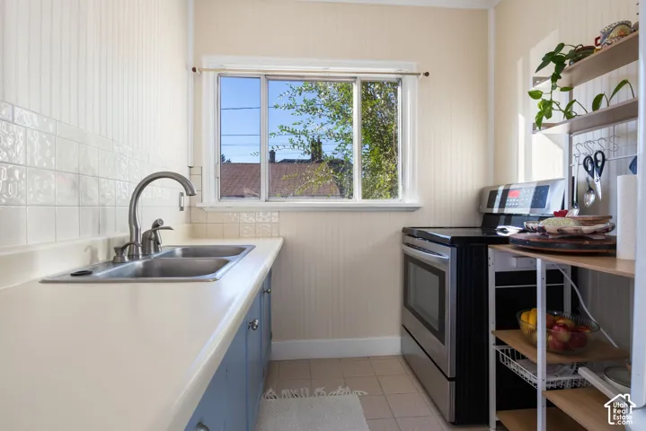 Galley style kitchen with free standing range.