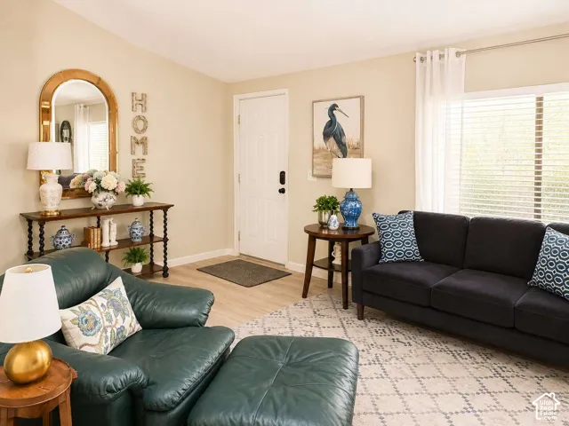 Light wood-finish flooring complements neutral wall tones