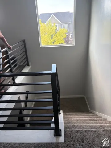 Modern black metal stair railing with horizontal balusters