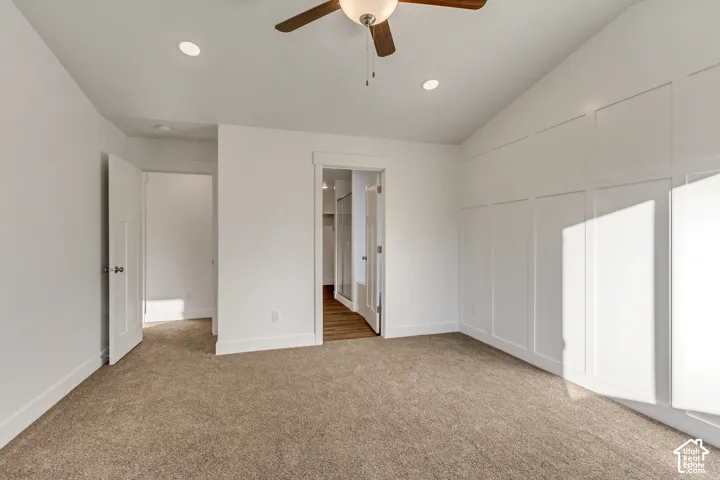 Vaulted ceiling featuring a ceiling fan with integrated lighting