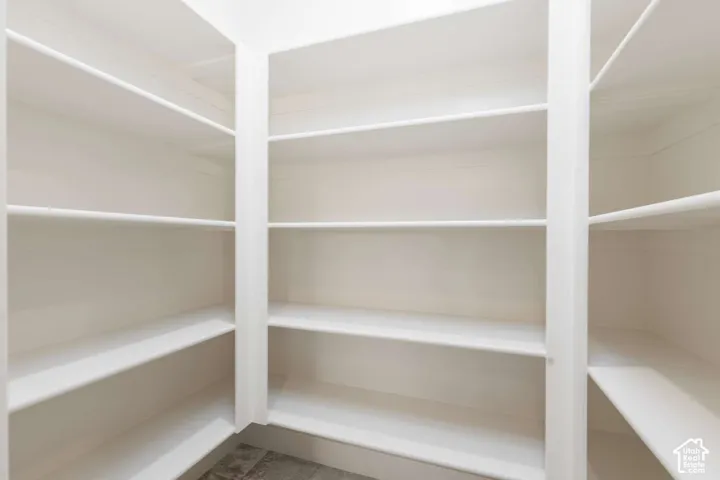Built-in white shelving system featuring multiple storage levels