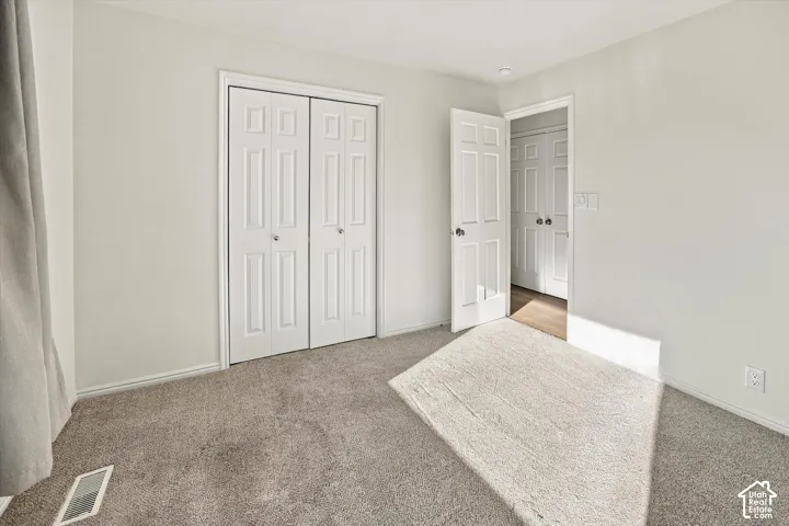 Neutral-toned wall paint with textured carpeting