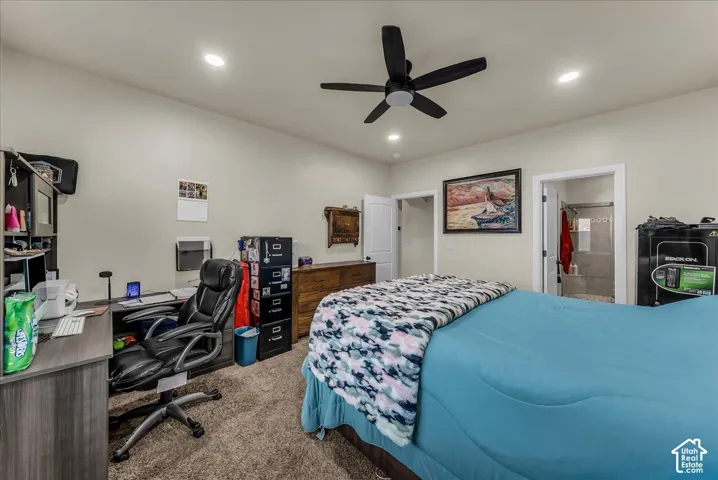 Carpeted flooring, recessed lighting, ceiling fan, and white trim