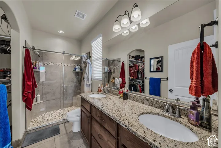 Dual vanity with stone countertop and undermount sinks