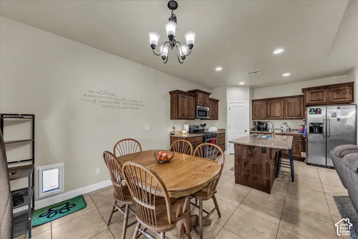 Kitchen featuring wood-finish cabinetry, granite countertops, and stainless steel appliances