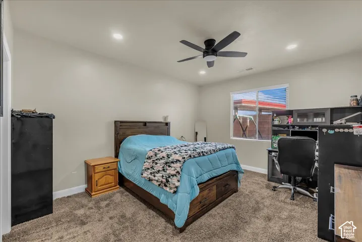 Carpet flooring, recessed lighting, ceiling fan, and window with blinds