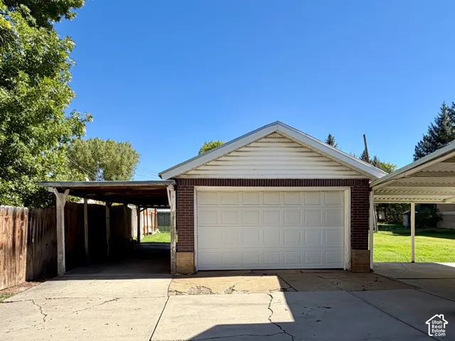 Attached garage with white panel door