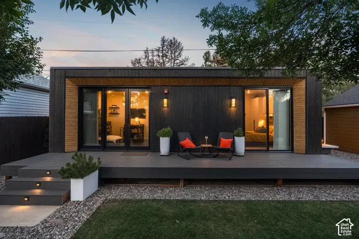 Modern exterior featuring dark-stained wood siding and natural wood accents
