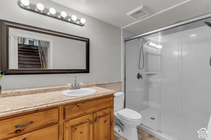 Bathroom vanity with a light-toned countertop and an undermount sink