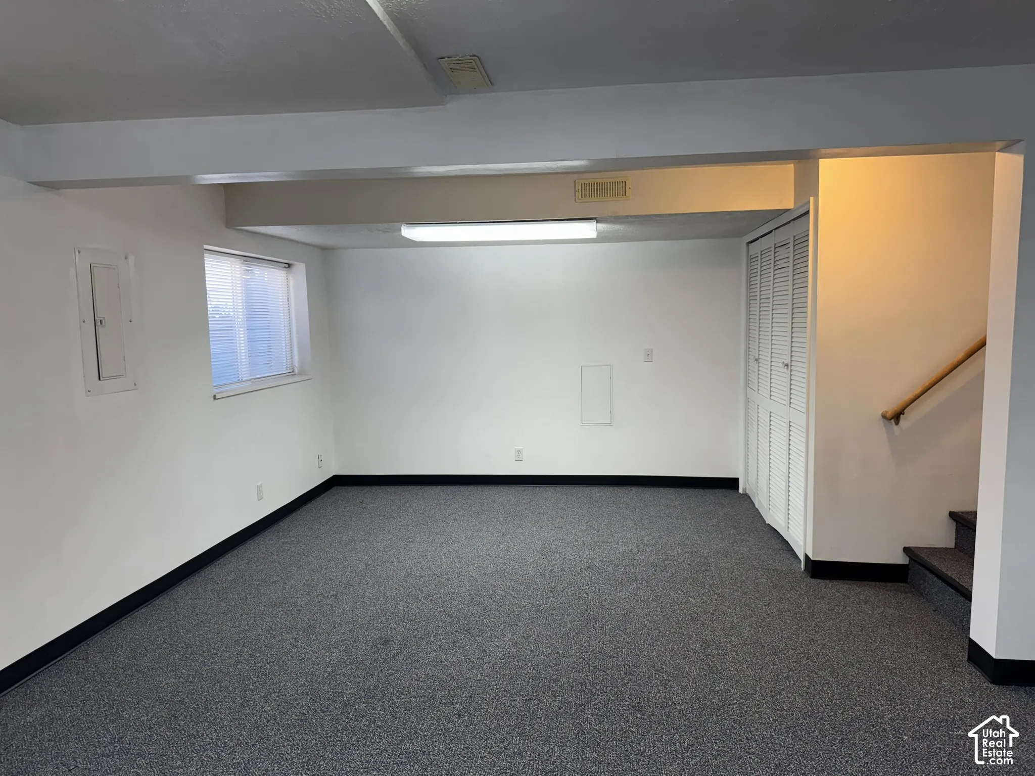 Carpeted flooring with white walls