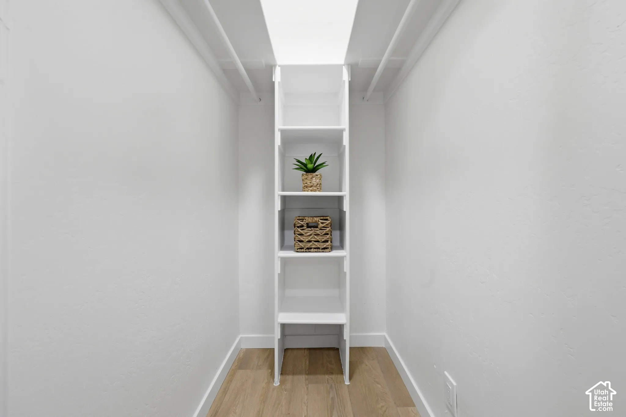 Built-in shelving unit with wood-finish flooring