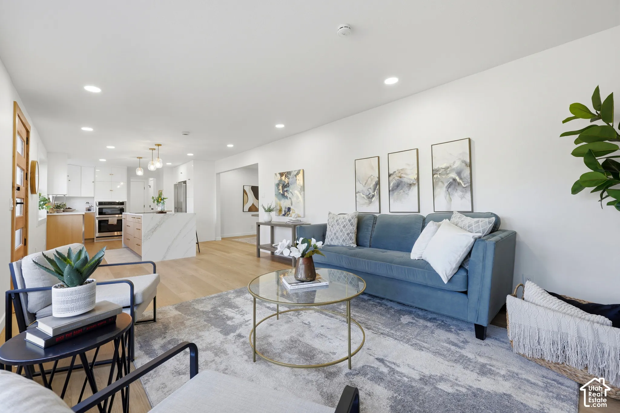 Open-concept interior with light wood-finish flooring
